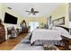 Main bedroom with hardwood floors and antique furniture at 15105 Aldama Cir, Port Charlotte, FL 33981