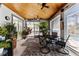 Covered patio with pool access, wooden ceiling, and comfortable seating at 15105 Aldama Cir, Port Charlotte, FL 33981