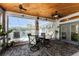 Enjoy this screened lanai with pool view and comfortable seating area at 15105 Aldama Cir, Port Charlotte, FL 33981