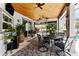 Covered patio with pool access, wooden ceiling, and comfortable seating at 15105 Aldama Cir, Port Charlotte, FL 33981