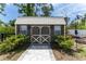 Spacious storage shed with windows and a pathway at 15105 Aldama Cir, Port Charlotte, FL 33981