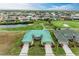 Aerial view of houses with green roofs near a golf course at 1551 Atares Dr # 112, Punta Gorda, FL 33950