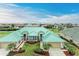 Aerial view of a beautiful home with a green metal roof and lush landscaping at 1551 Atares Dr # 112, Punta Gorda, FL 33950