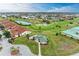 Community overview with houses, golf course, and water features at 1551 Atares Dr # 112, Punta Gorda, FL 33950