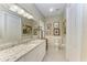 Clean bathroom, granite countertop, and walk-in shower at 1551 Atares Dr # 112, Punta Gorda, FL 33950