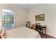 Cozy bedroom with a desk and stained glass window at 1551 Atares Dr # 112, Punta Gorda, FL 33950