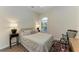 Charming bedroom with wood flooring and a desk area at 1551 Atares Dr # 112, Punta Gorda, FL 33950
