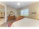 Bright bedroom featuring a dresser and views into another room at 1551 Atares Dr # 112, Punta Gorda, FL 33950