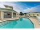 Inviting community pool area with surrounding building at 1551 Atares Dr # 112, Punta Gorda, FL 33950