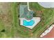 Aerial view of community pool and surrounding landscape at 1551 Atares Dr # 112, Punta Gorda, FL 33950