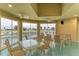Community room with pool view, tables, and chairs at 1551 Atares Dr # 112, Punta Gorda, FL 33950