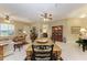 Open concept dining room with a rustic wooden table and access to living areas at 1551 Atares Dr # 112, Punta Gorda, FL 33950