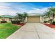 House exterior features a green metal roof and landscaped yard at 1551 Atares Dr # 112, Punta Gorda, FL 33950