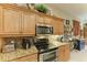 Modern kitchen features granite countertops and stainless steel appliances at 1551 Atares Dr # 112, Punta Gorda, FL 33950