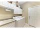 Laundry room with washer, dryer, and cabinets at 1551 Atares Dr # 112, Punta Gorda, FL 33950