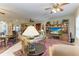 Spacious living room with ample seating and a view into the dining and kitchen areas at 1551 Atares Dr # 112, Punta Gorda, FL 33950