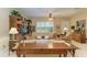 Spacious living room with large windows and comfortable seating at 1551 Atares Dr # 112, Punta Gorda, FL 33950