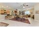Open concept living and dining area with a rustic wooden table and comfy seating at 1551 Atares Dr # 112, Punta Gorda, FL 33950