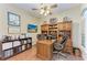 Home office with built-in shelving and hardwood floors at 1551 Atares Dr # 112, Punta Gorda, FL 33950