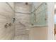 Walk-in shower with tiled walls and built-in seat at 1551 Atares Dr # 112, Punta Gorda, FL 33950