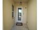 Front entry with door, small mat, and a window at 17074 Acapulco Rd # 112, Punta Gorda, FL 33955