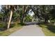 Paved pathway winds through a lush, tree-lined park at 17074 Acapulco Rd # 112, Punta Gorda, FL 33955