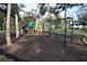 playground with swings and climbing structure at 17074 Acapulco Rd # 112, Punta Gorda, FL 33955