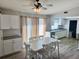 Eat-in kitchen with white table and chairs, and access to a back deck at 17455 Masten Ave, Port Charlotte, FL 33954