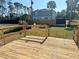 Wooden deck with railing overlooking a grassy backyard at 17455 Masten Ave, Port Charlotte, FL 33954