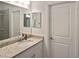Bathroom with granite countertop, sink, and mirror at 17764 Palmetto Pass Ln, Punta Gorda, FL 33982