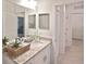Bathroom with granite countertop and double sinks at 17764 Palmetto Pass Ln, Punta Gorda, FL 33982