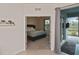 Bedroom with a bed and access to the patio at 17764 Palmetto Pass Ln, Punta Gorda, FL 33982