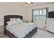 Bright bedroom with a comfortable bed, window, and dresser at 17764 Palmetto Pass Ln, Punta Gorda, FL 33982