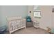Bedroom with crib, rocking chair, and window at 17764 Palmetto Pass Ln, Punta Gorda, FL 33982