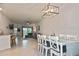 Open dining room with table and view of living room at 17764 Palmetto Pass Ln, Punta Gorda, FL 33982