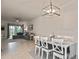 Bright dining area with white table and chairs, view of living room at 17764 Palmetto Pass Ln, Punta Gorda, FL 33982