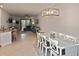 Dining area with white table and chairs, open to kitchen at 17764 Palmetto Pass Ln, Punta Gorda, FL 33982