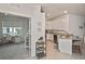 Modern kitchen with white cabinets, granite counters, and stainless steel appliances at 17764 Palmetto Pass Ln, Punta Gorda, FL 33982