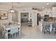 Open kitchen with island and view of dining area at 17764 Palmetto Pass Ln, Punta Gorda, FL 33982