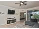 Living room with sectional sofa, TV and view into bedroom at 17764 Palmetto Pass Ln, Punta Gorda, FL 33982