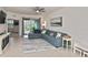 Spacious living room with sectional sofa and access to a patio at 17764 Palmetto Pass Ln, Punta Gorda, FL 33982