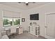 Office with desk, TV, and plenty of storage at 17764 Palmetto Pass Ln, Punta Gorda, FL 33982