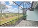 Enjoy this peaceful screened patio with a view of nature at 17764 Palmetto Pass Ln, Punta Gorda, FL 33982