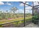 Serene screened patio offering a picturesque natural view at 17764 Palmetto Pass Ln, Punta Gorda, FL 33982