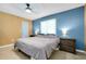 Comfortable bedroom includes king-size bed, nightstands, and ceiling fan at 18235 Avonsdale Cir, Port Charlotte, FL 33948