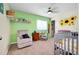 Bedroom with sunflower wall art and crib at 18235 Avonsdale Cir, Port Charlotte, FL 33948