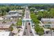 Aerial view of Treasure Island street scene with palm trees and shops at 1845 Edison Dr, Englewood, FL 34224