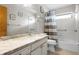 Bathroom with granite vanity and tub shower at 1845 Edison Dr, Englewood, FL 34224