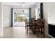 Bright dining area with wooden table and chairs near patio at 1845 Edison Dr, Englewood, FL 34224