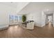 Living room with hardwood floors, ample natural light, and comfortable seating at 1849 Jamaica Way, Punta Gorda, FL 33950